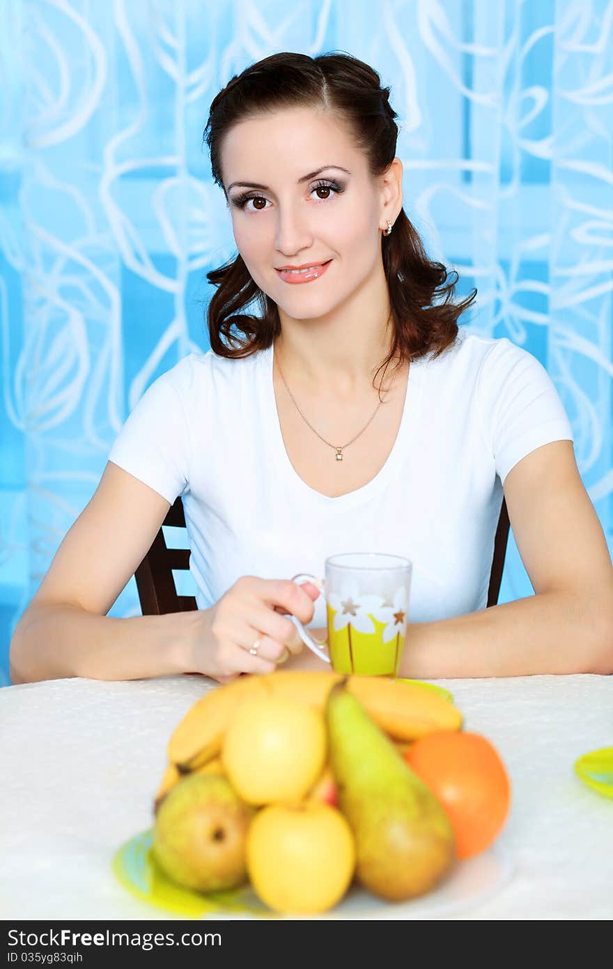 Young woman is having a breakfast at home.