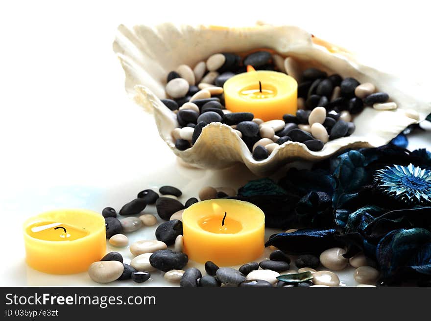 Candles, seashell and potpourri closeup