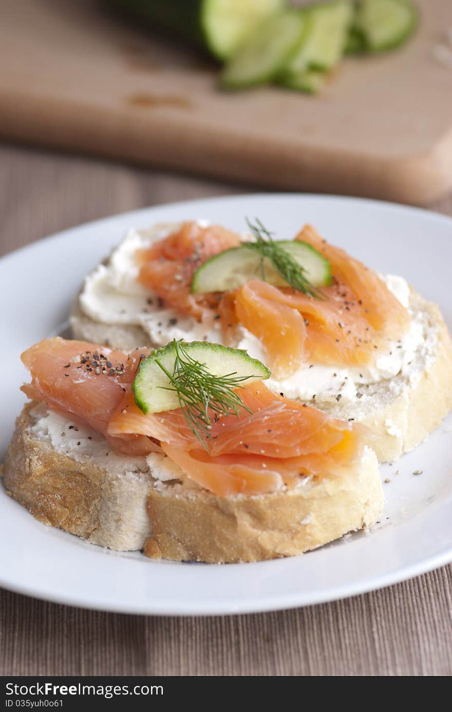 Toasted bread with cheese spread and smoked salmon. Toasted bread with cheese spread and smoked salmon