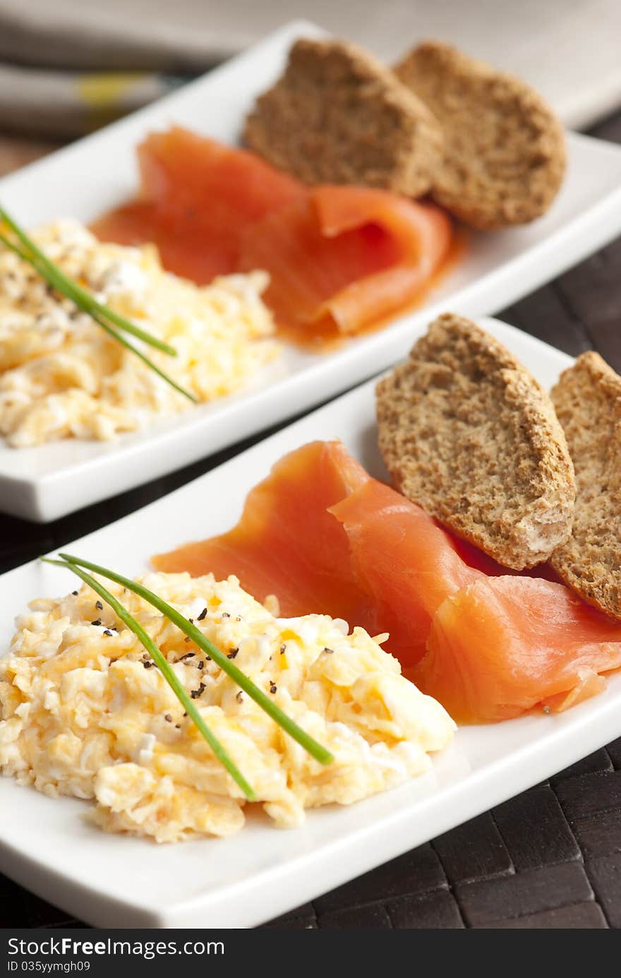 Smoked salmon with scrambled egg and crisp bread. Smoked salmon with scrambled egg and crisp bread