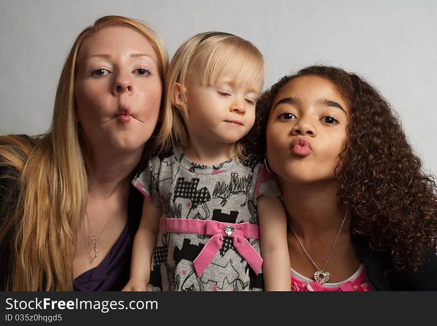 Three girls making faces