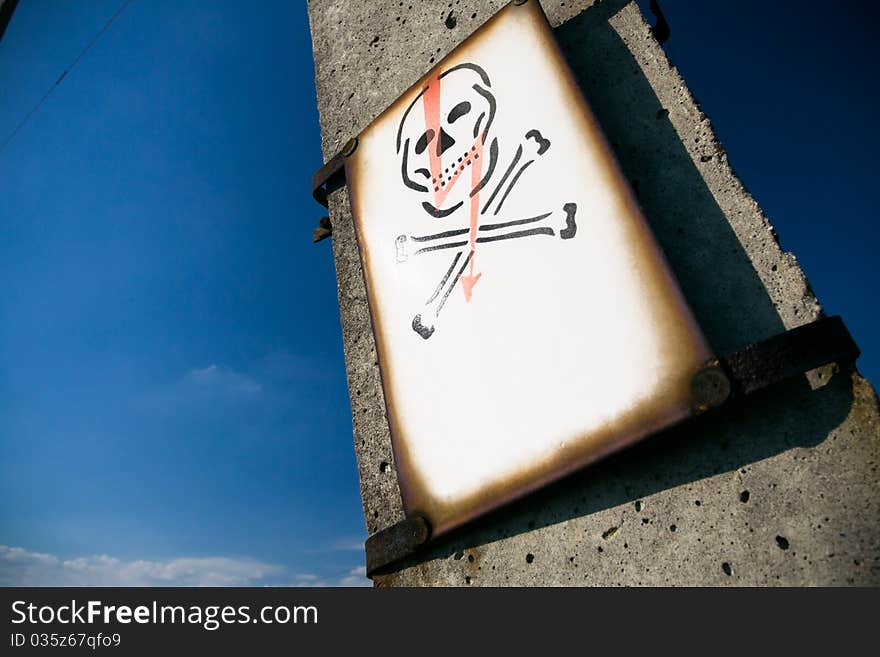 Electrical Skull Sign On Pylon