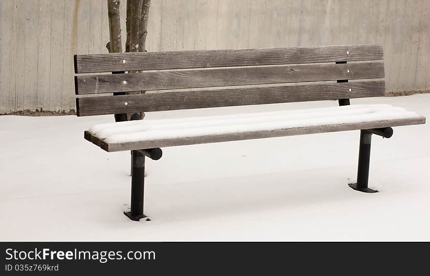 Snow Covered Wooden Bench