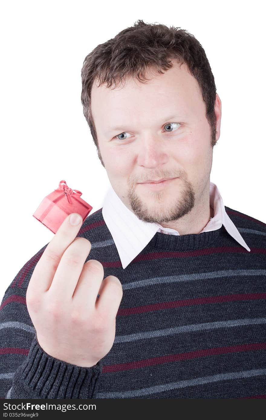 Young man holding valentine gift in his hand