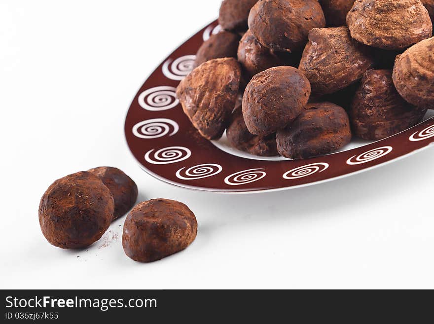 Chocolate truffles for dessert plate on the white background