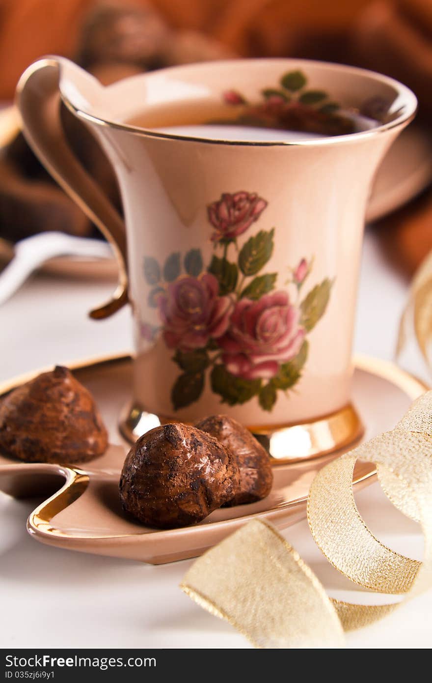 Cup of tea with chocolate truffles