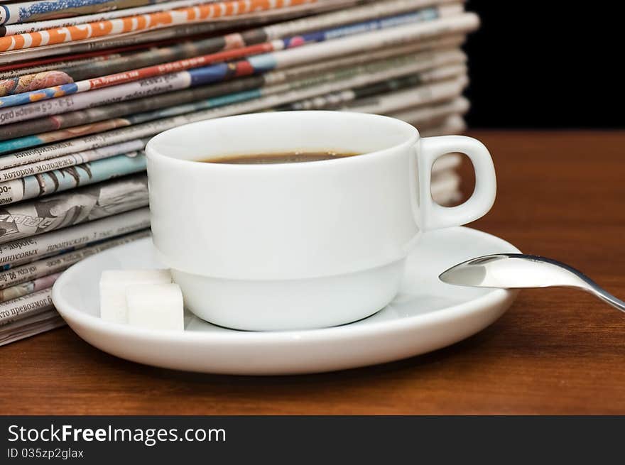 Cup from coffee and the newspaper still life