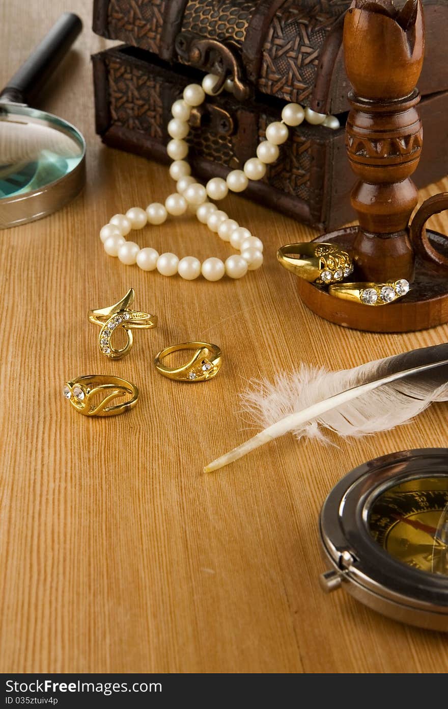 Image of old fashioned jewels and feather