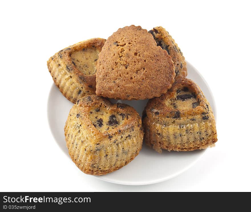 Muffins with chocolate in a heart on a white background