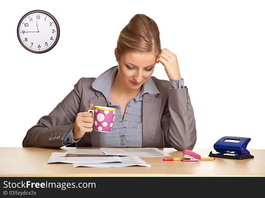 Woman in suit sitting at the desk isolated on white