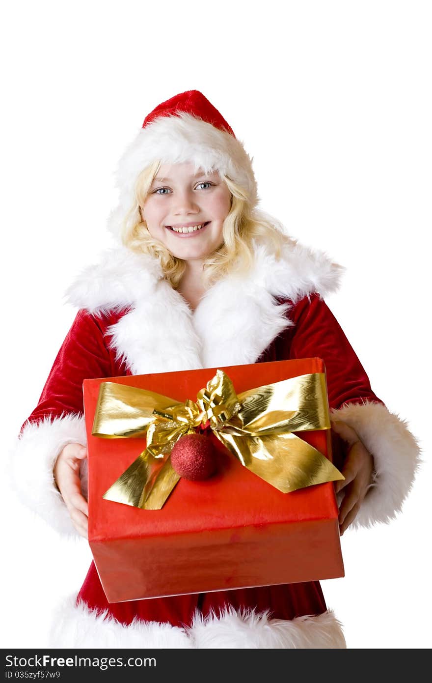 Young girl with christmas present smiles happy. Isolated on white background.