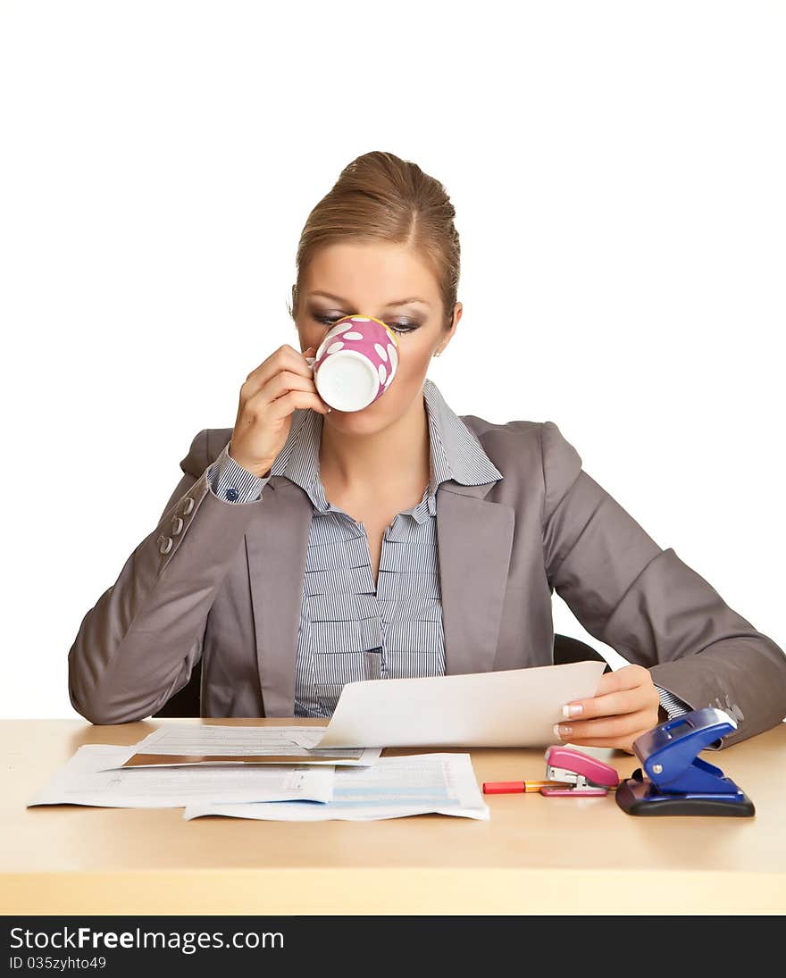 Woman in suit sitting at the desk