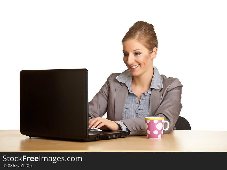 Woman in suit sitting at the desk