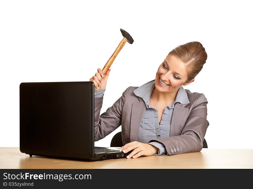 Woman in suit sitting at the desk isolated on white