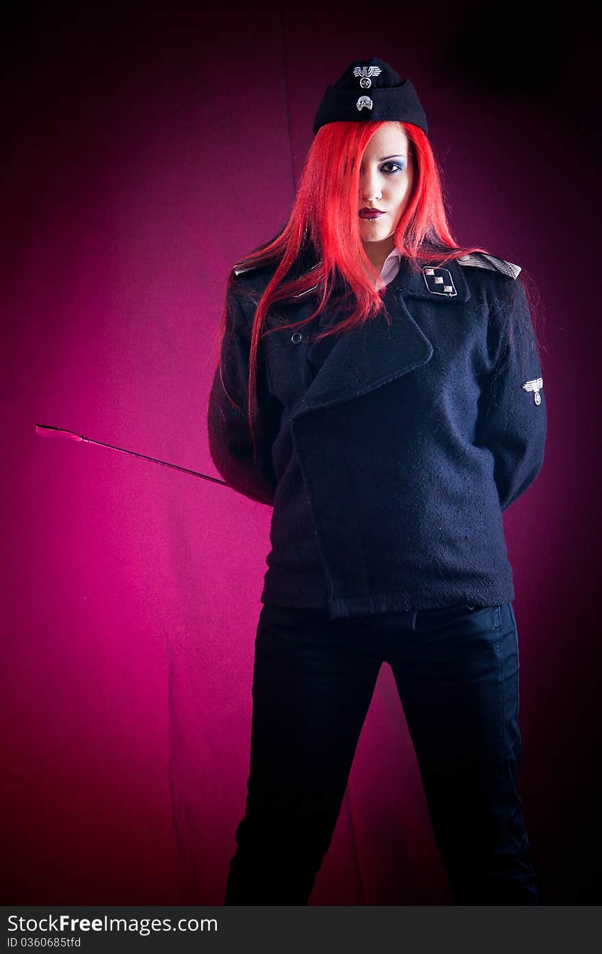 Female dressed in uniform in studio with red hair. Female dressed in uniform in studio with red hair