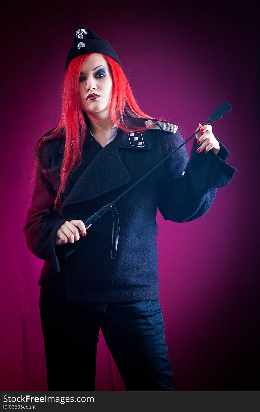 Female dressed in uniform in studio with red hair. Female dressed in uniform in studio with red hair