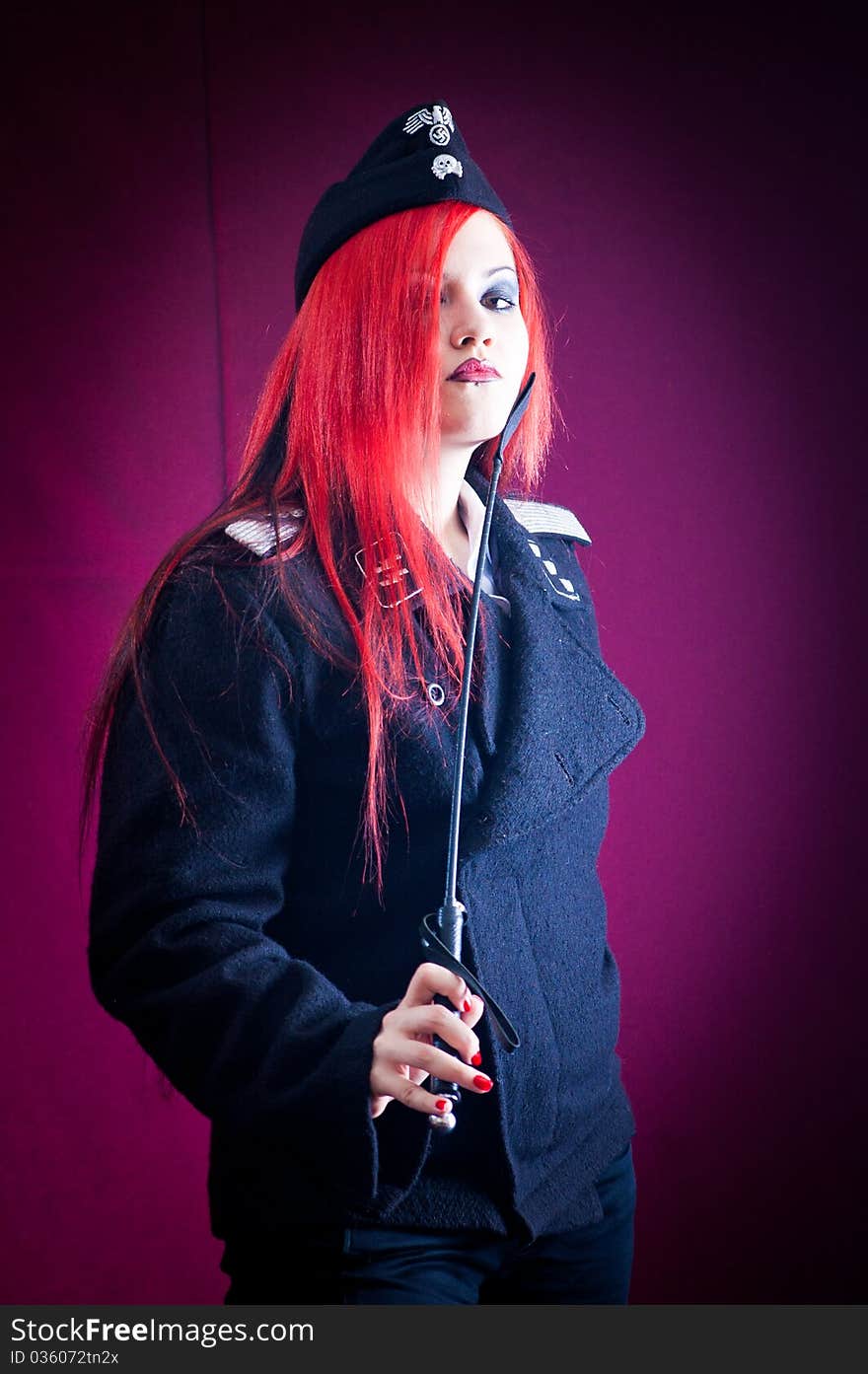 Female dressed in uniform in studio with red hair. Female dressed in uniform in studio with red hair