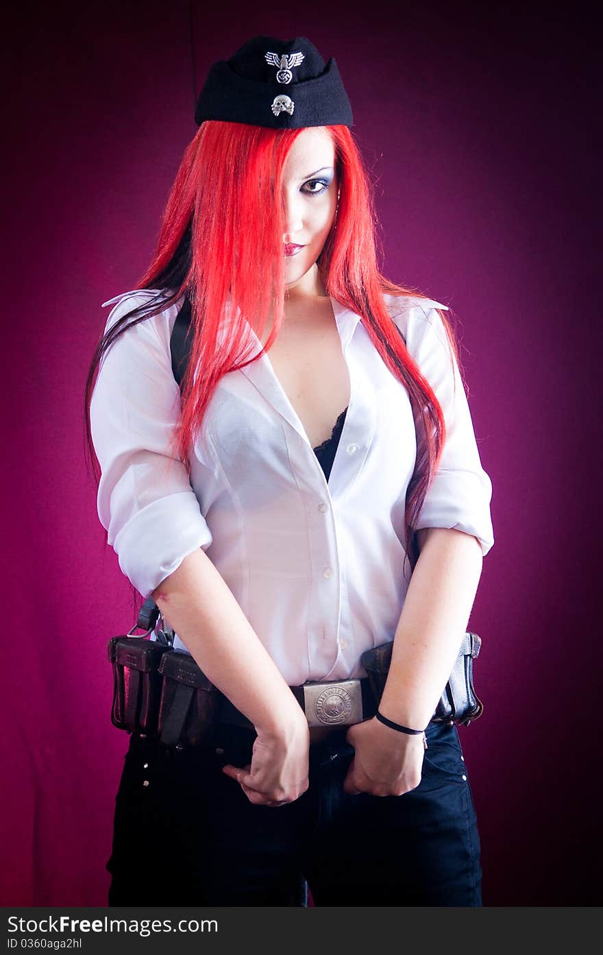 Female dressed in uniform in studio with red hair. Female dressed in uniform in studio with red hair