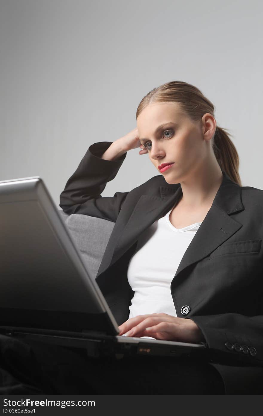 Portrait of a businesswoman using a laptop. Portrait of a businesswoman using a laptop