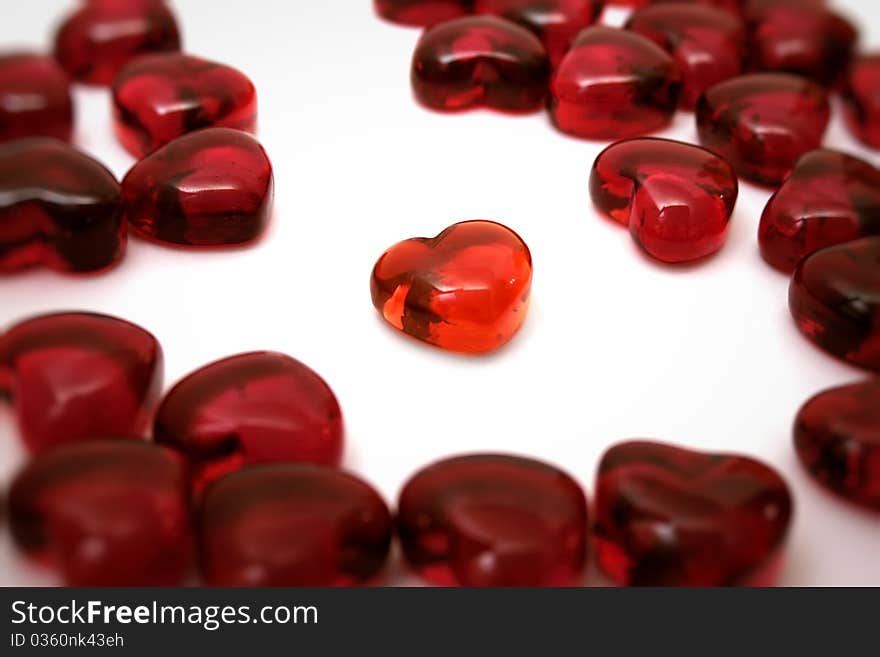 Bright red heart on a white background among others hearts