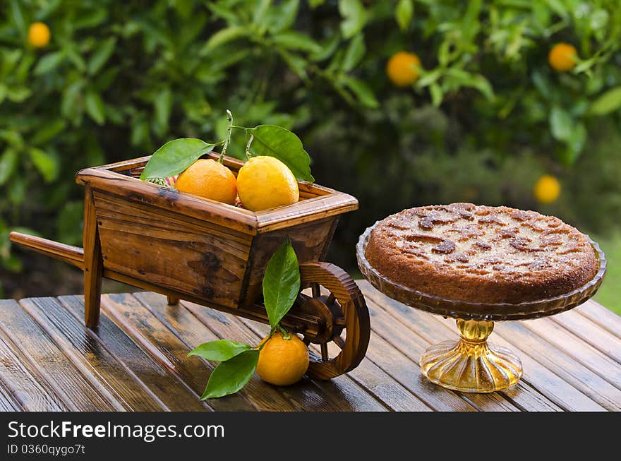 Beautiful Orange Cake Decorated With A Wheelbarr