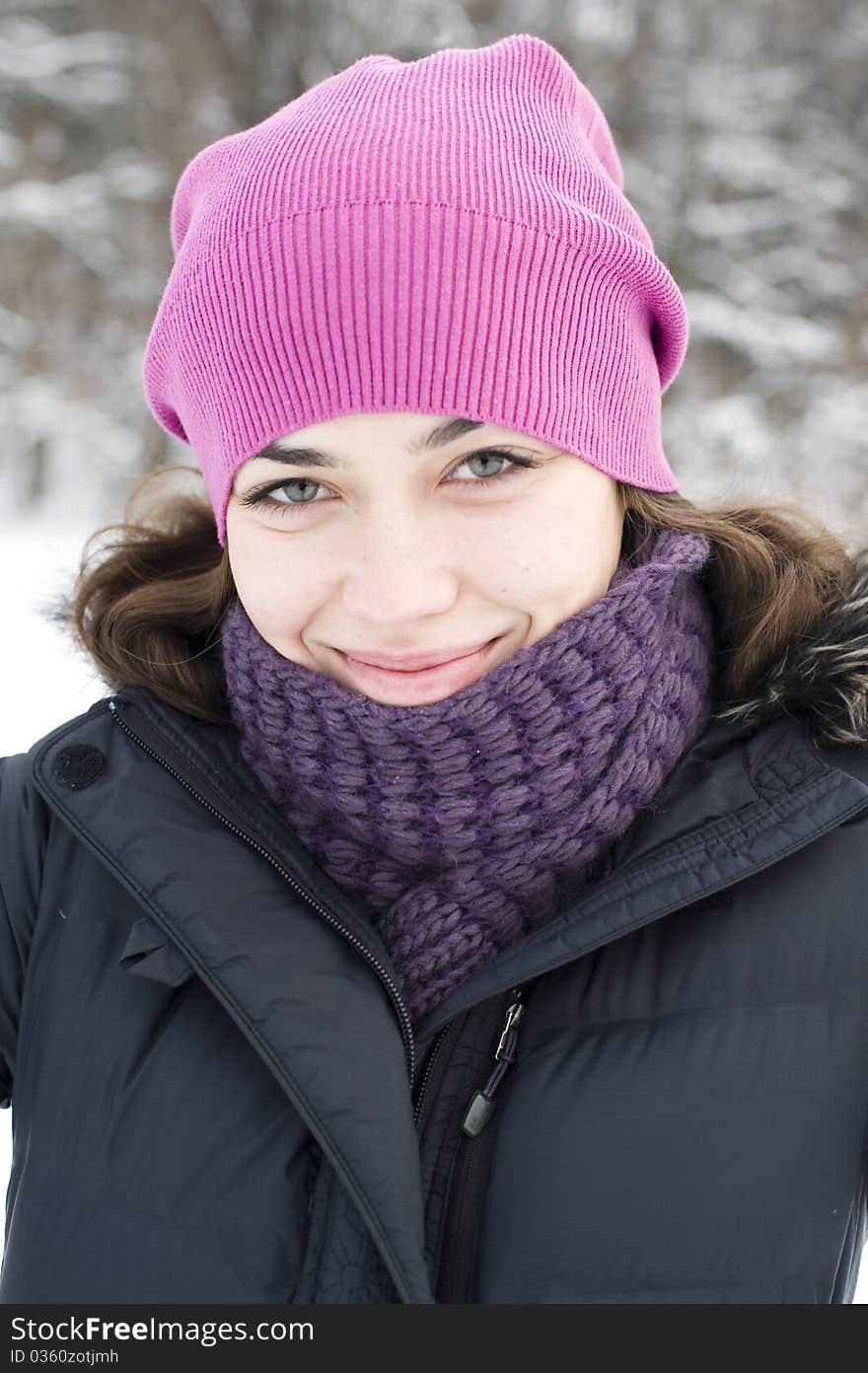 The young happy woman the brunette in a pink beret