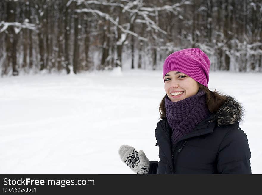 The young happy woman the brunette smiles against