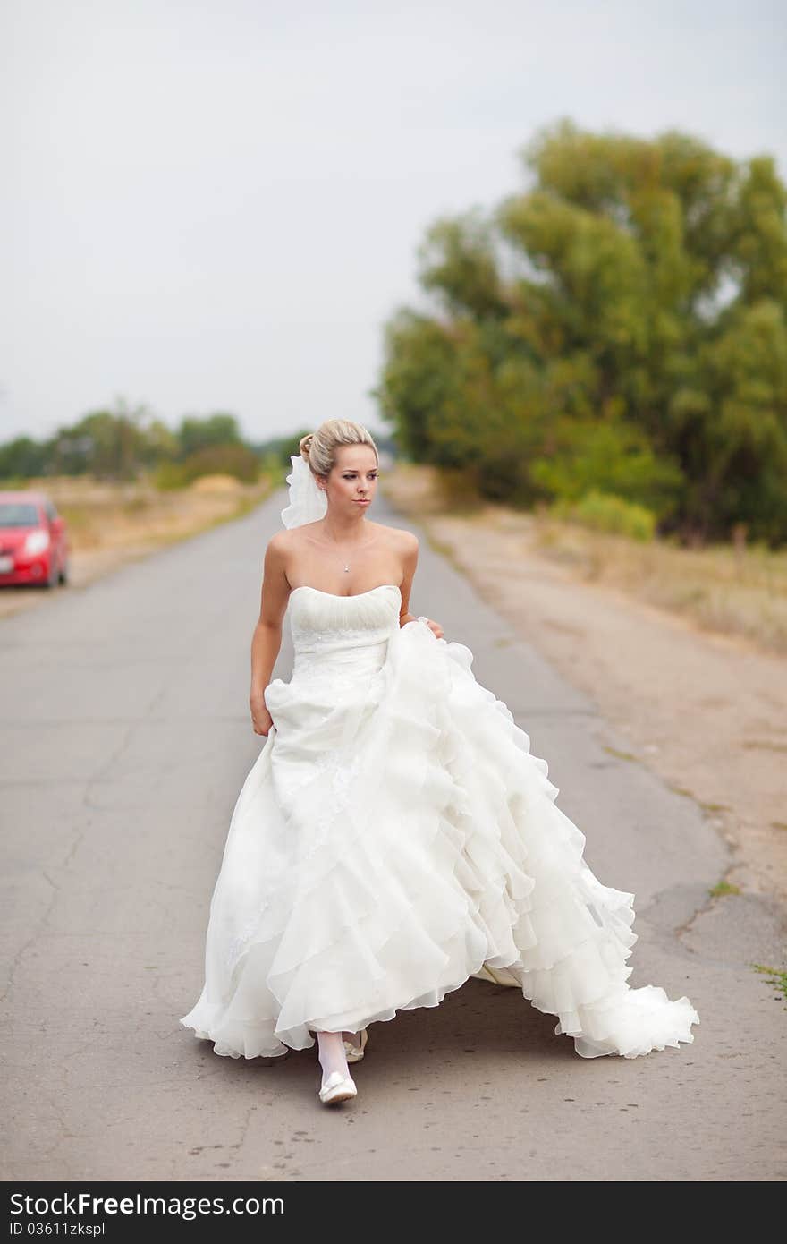 Walking bride on the road