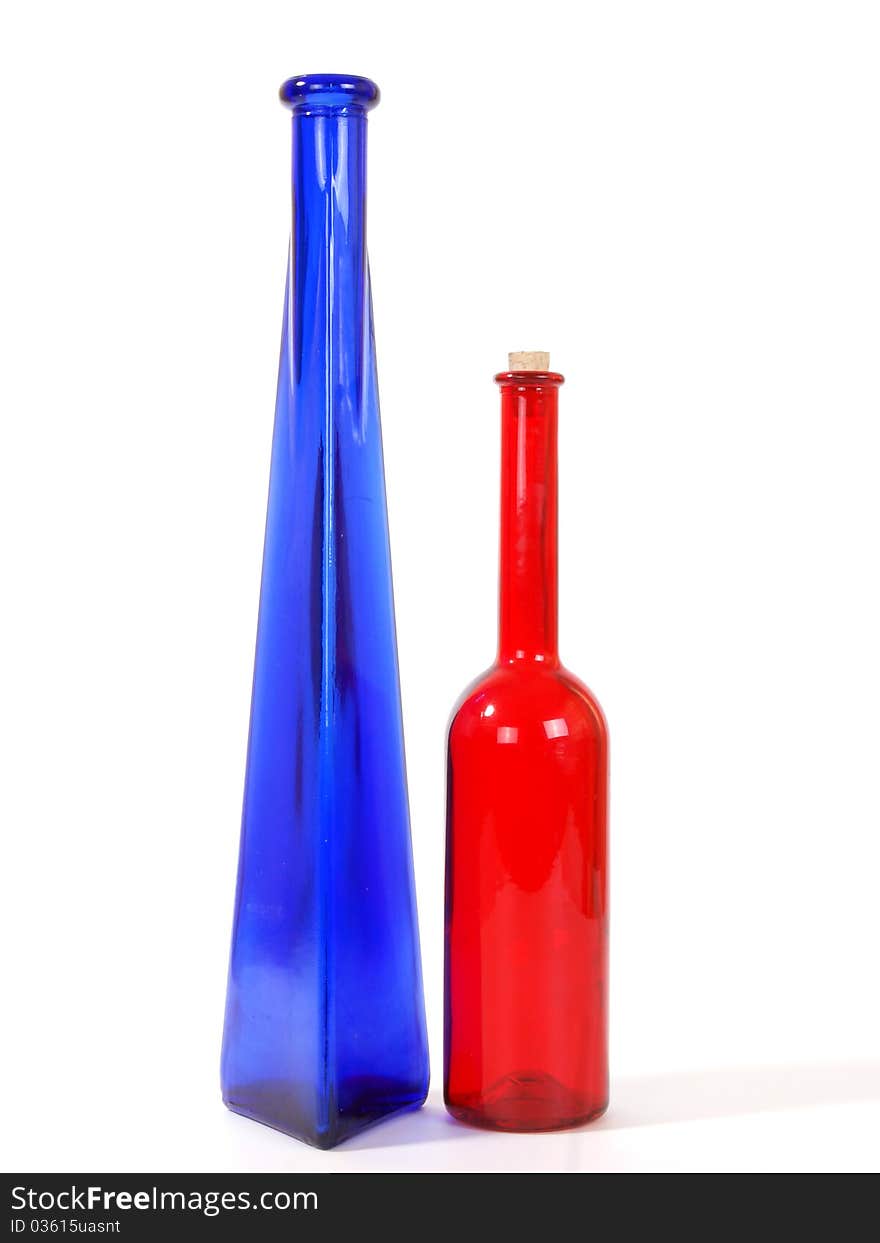 Colored glass vases on a white background