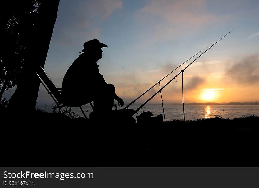 Fishing on background of water the fish man. Fishing on background of water the fish man