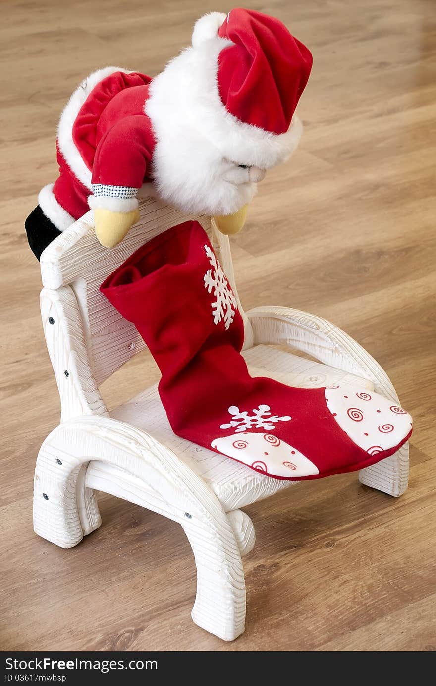 Toy Santa Claus on a wooden chair