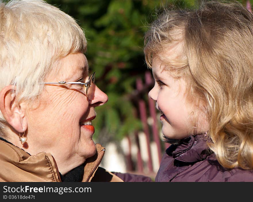 Happy grandmather and granddaughter