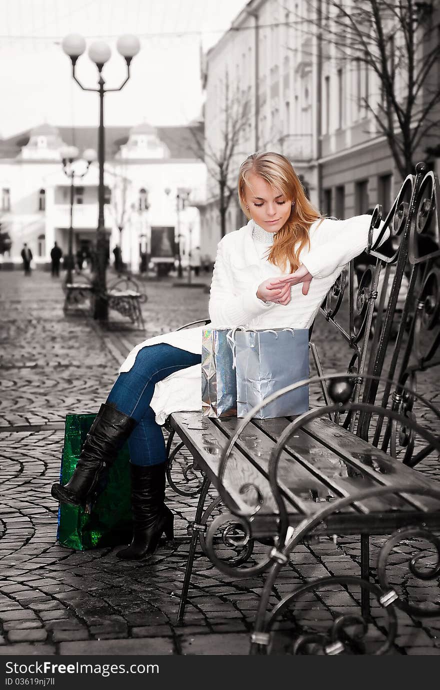 Woman Sitting On A Bench