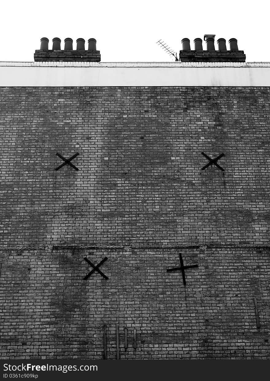 Massive firewall with chimney and cross