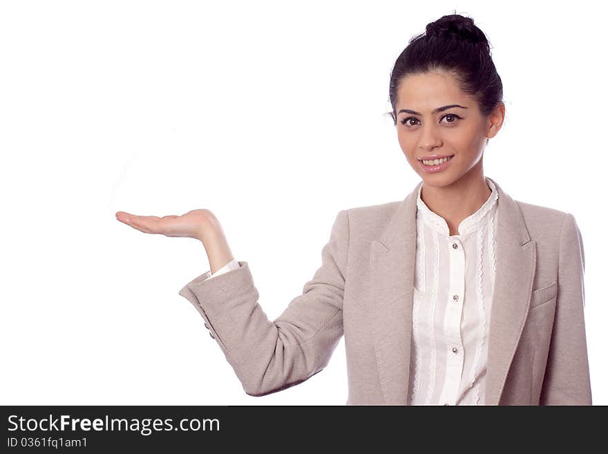 Business woman showing with hand on white space and smiling