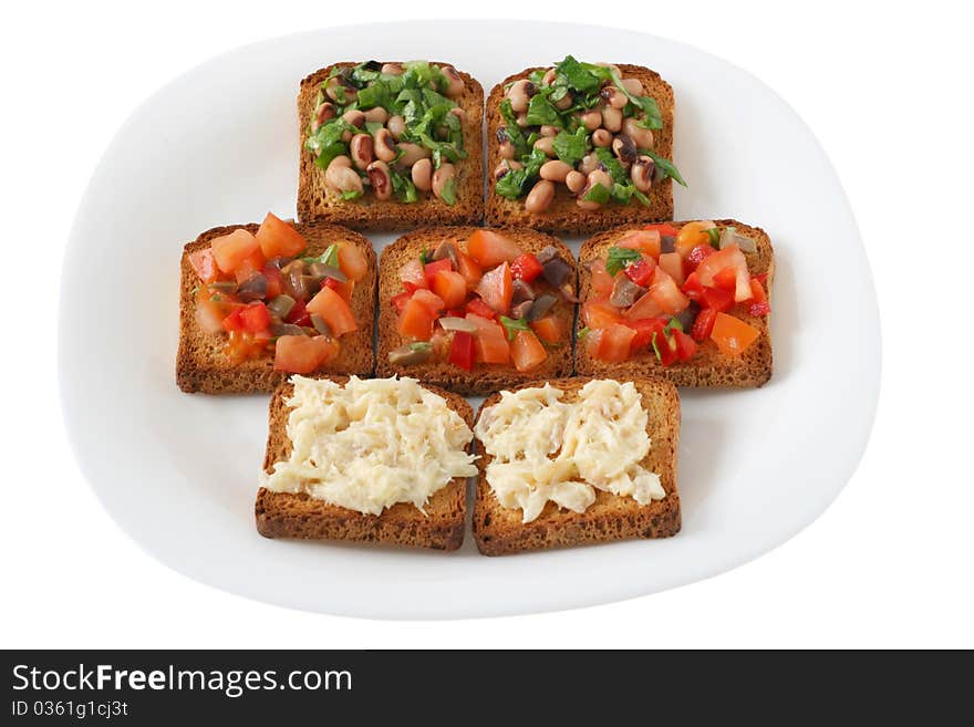 Toasts with tomato, beans and codfish