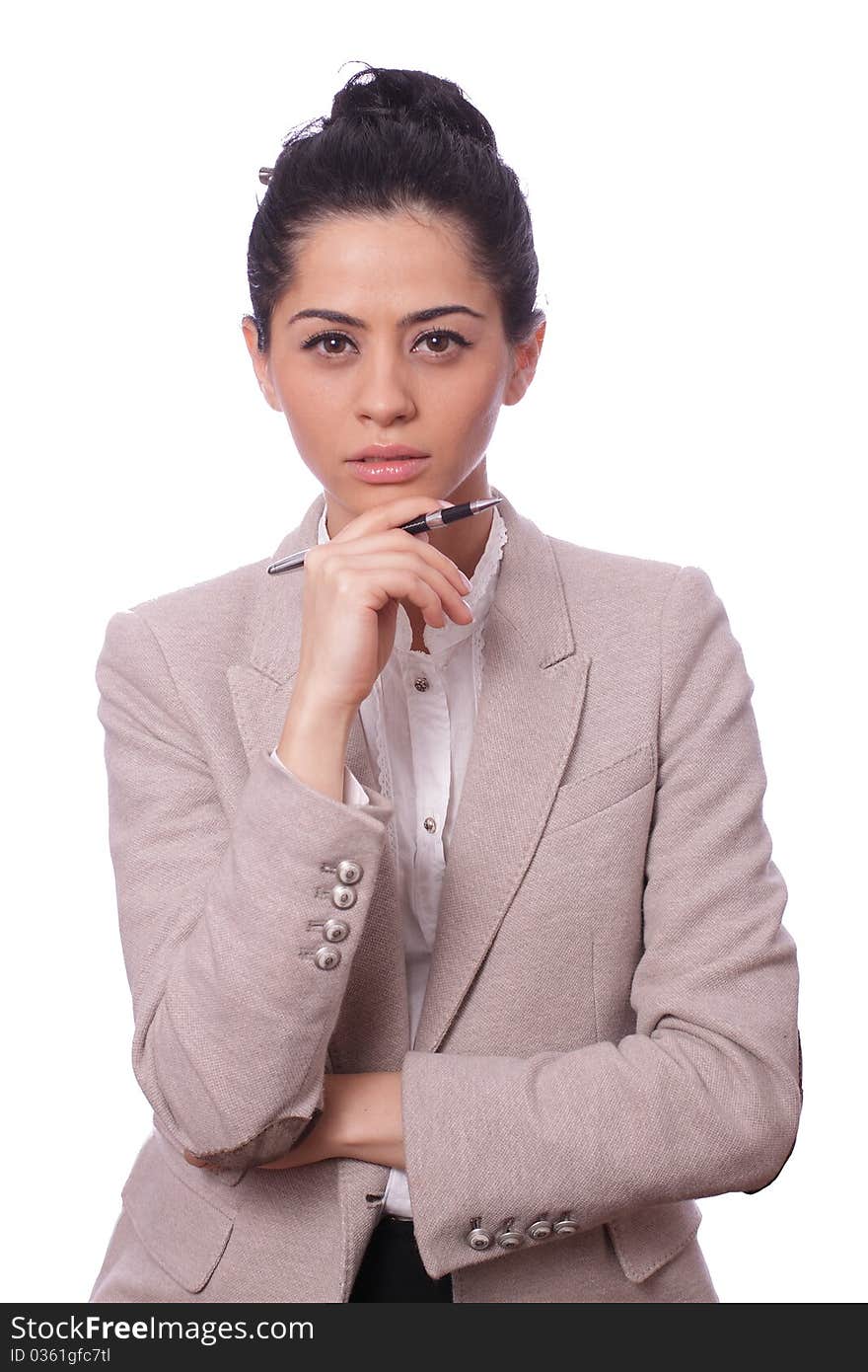 Portrait of a young business woman thinking holding a pen