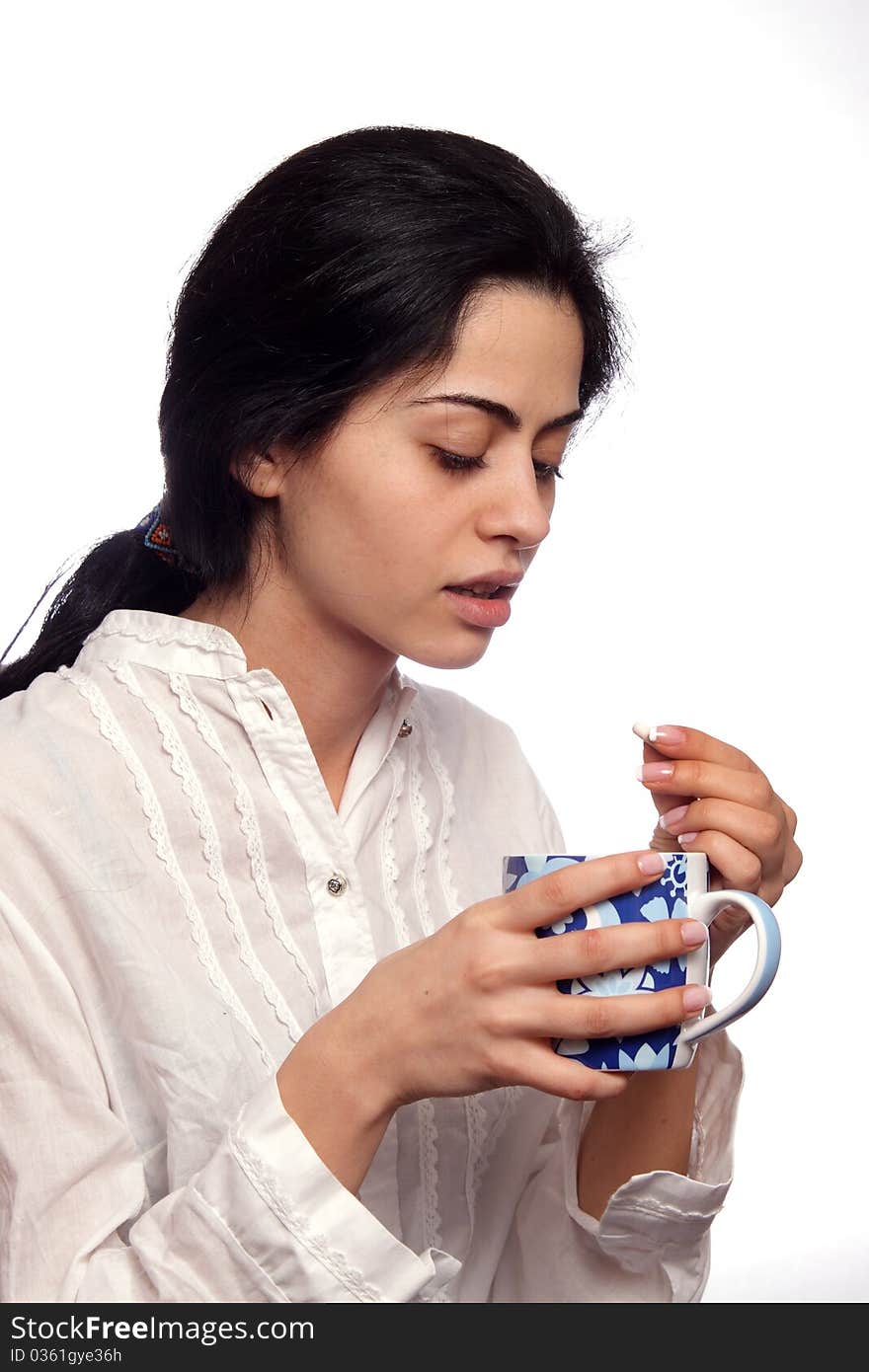 A young woman with a pill in hear hand. A young woman with a pill in hear hand.