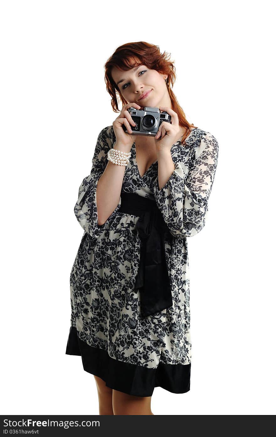 An image of a young woman with a camera. An image of a young woman with a camera