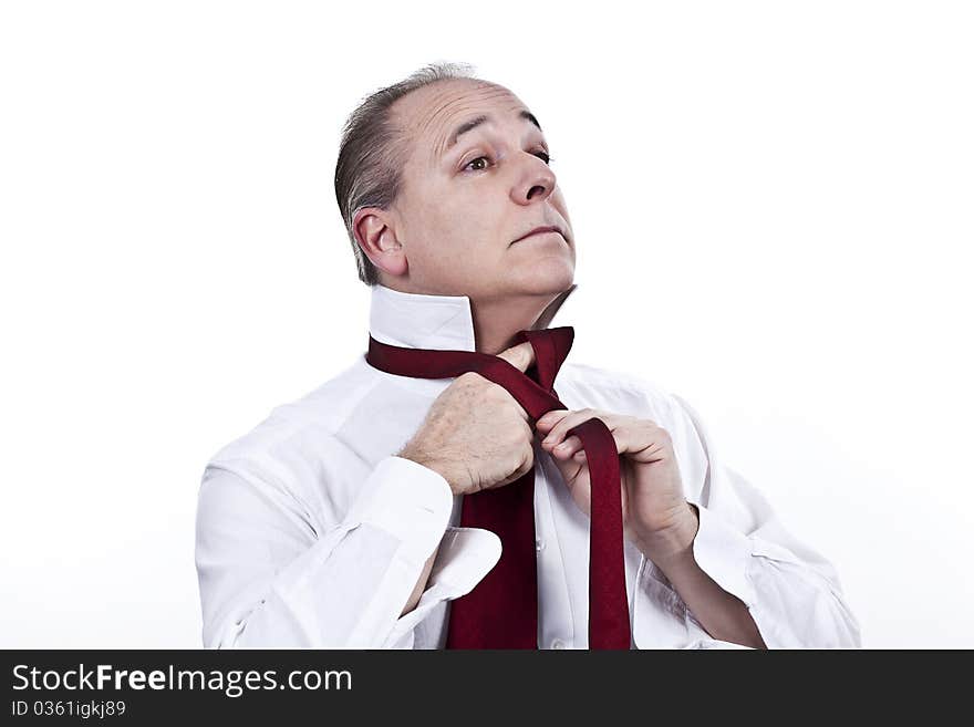 Businessmen finishing dressing up to go to work. Businessmen finishing dressing up to go to work