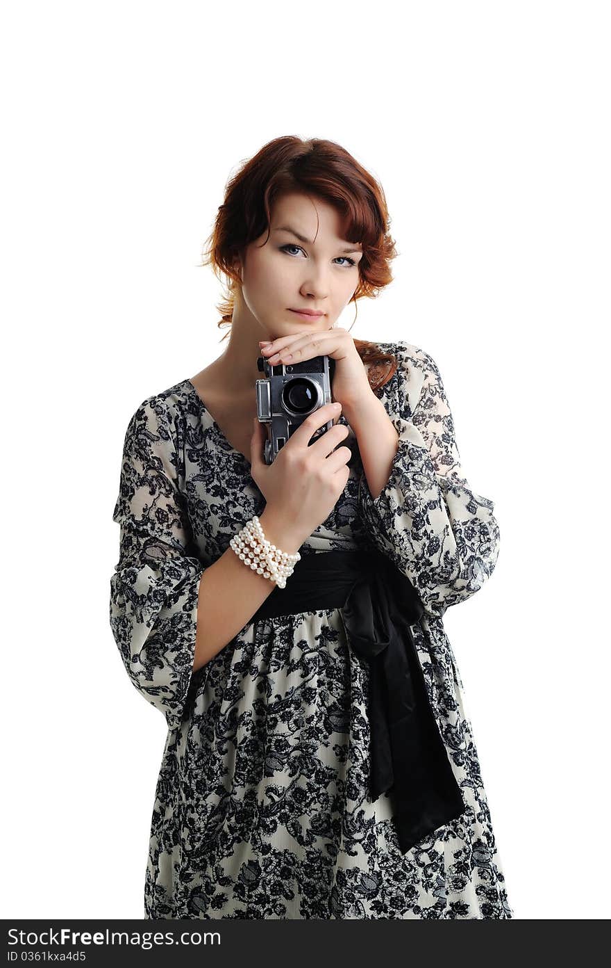 An image of a young woman with a camera. An image of a young woman with a camera