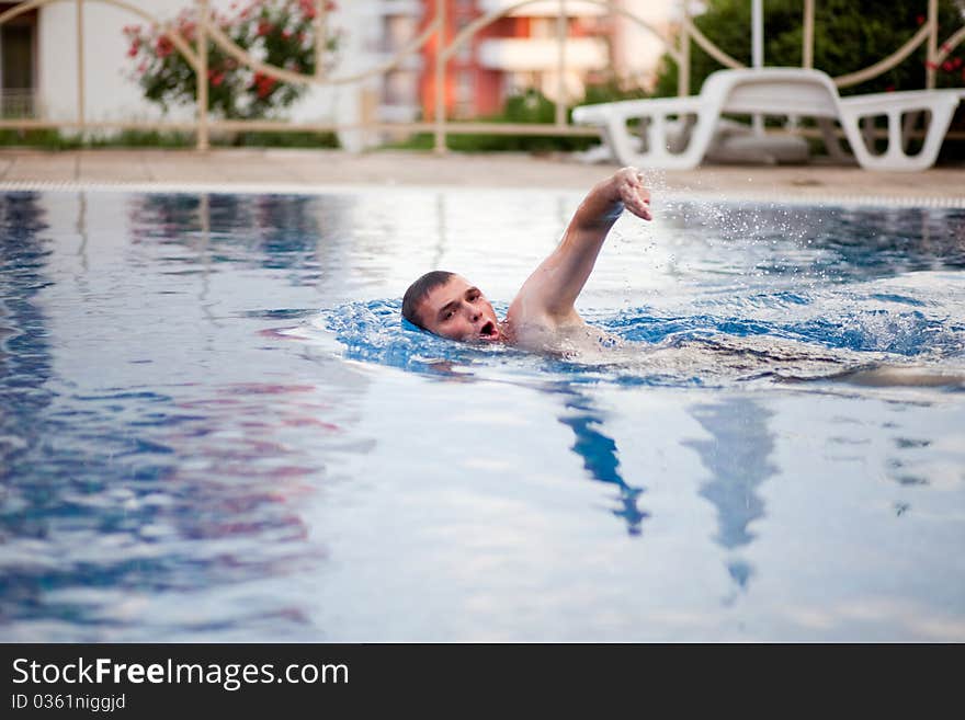 Man swimming in pool