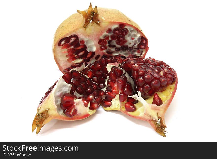 Pomegranate fresh and healthy, open over a white background