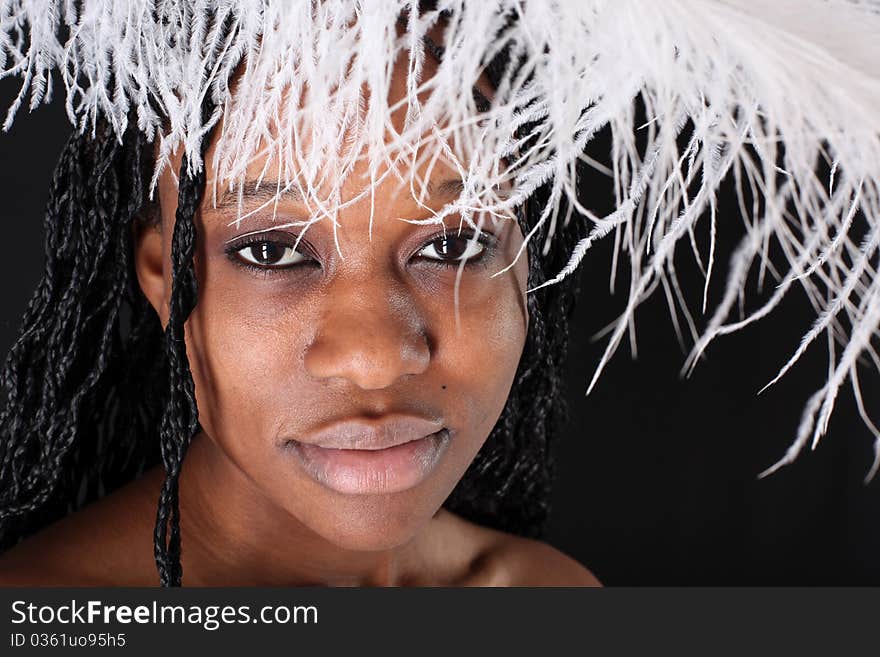 Afro-american woman with white feather