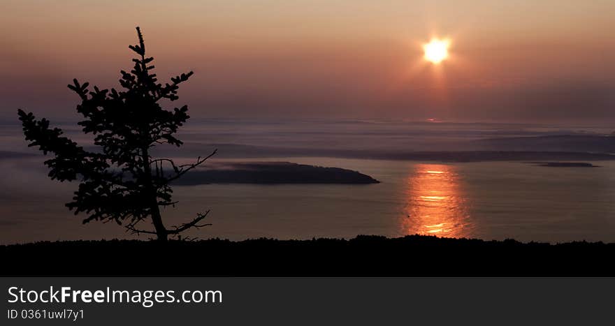 Cadillac Mountain where the first rays of sunlight hit the United States, located in Acadia National Park, Maine. Cadillac Mountain where the first rays of sunlight hit the United States, located in Acadia National Park, Maine.