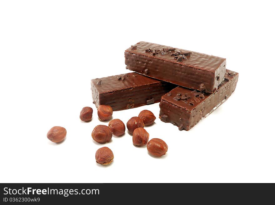 Wafers in chocolate with a nut are isolated on a white background