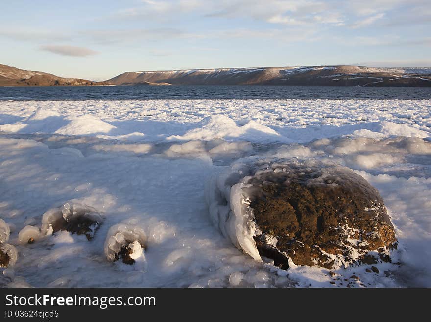 Frozen Ice lake and rock in Iceland. Frozen Ice lake and rock in Iceland