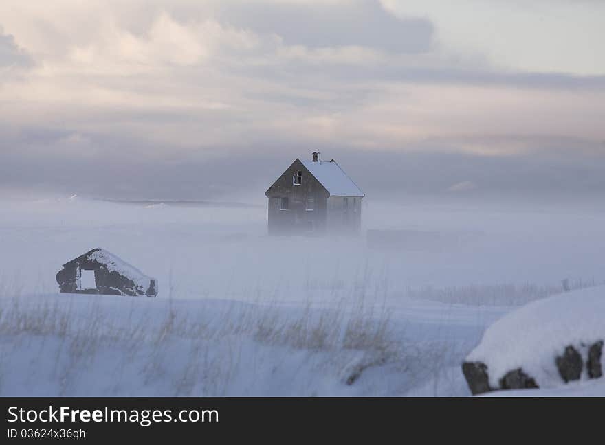 House in a Fog and Snow in Iceland. House in a Fog and Snow in Iceland