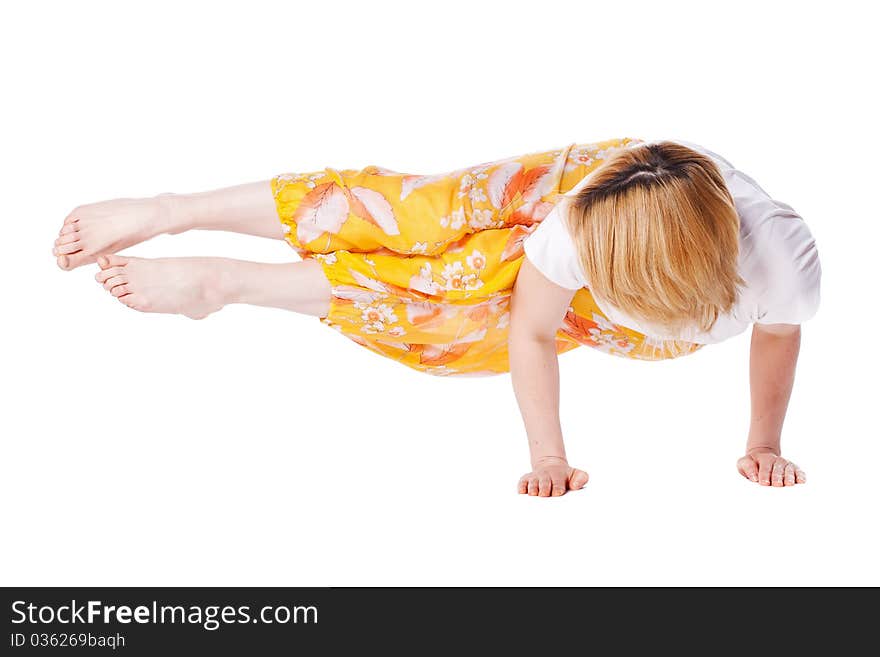 Young woman doing yoga exercise. isolated