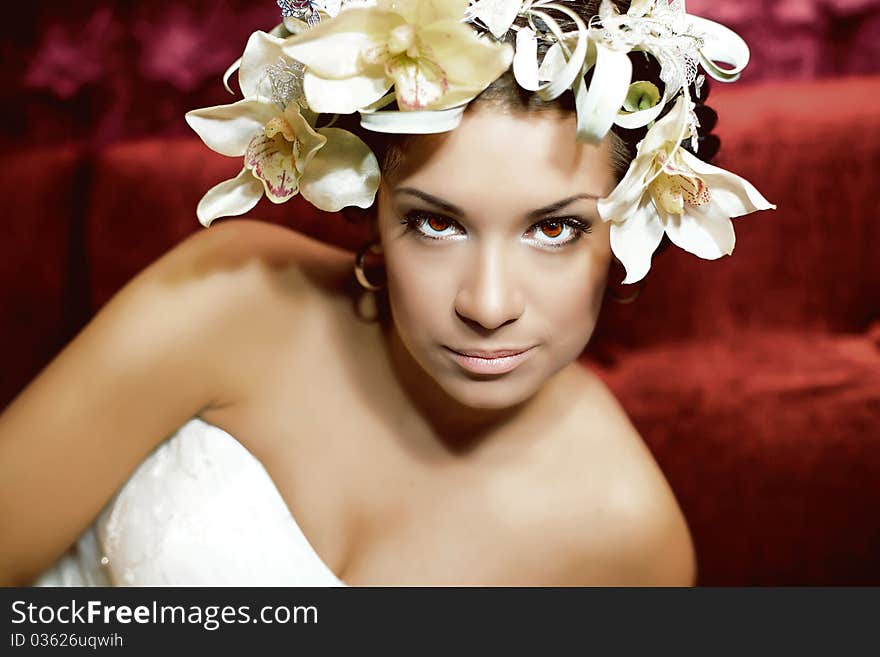 Young woman with an erotic look and flowers